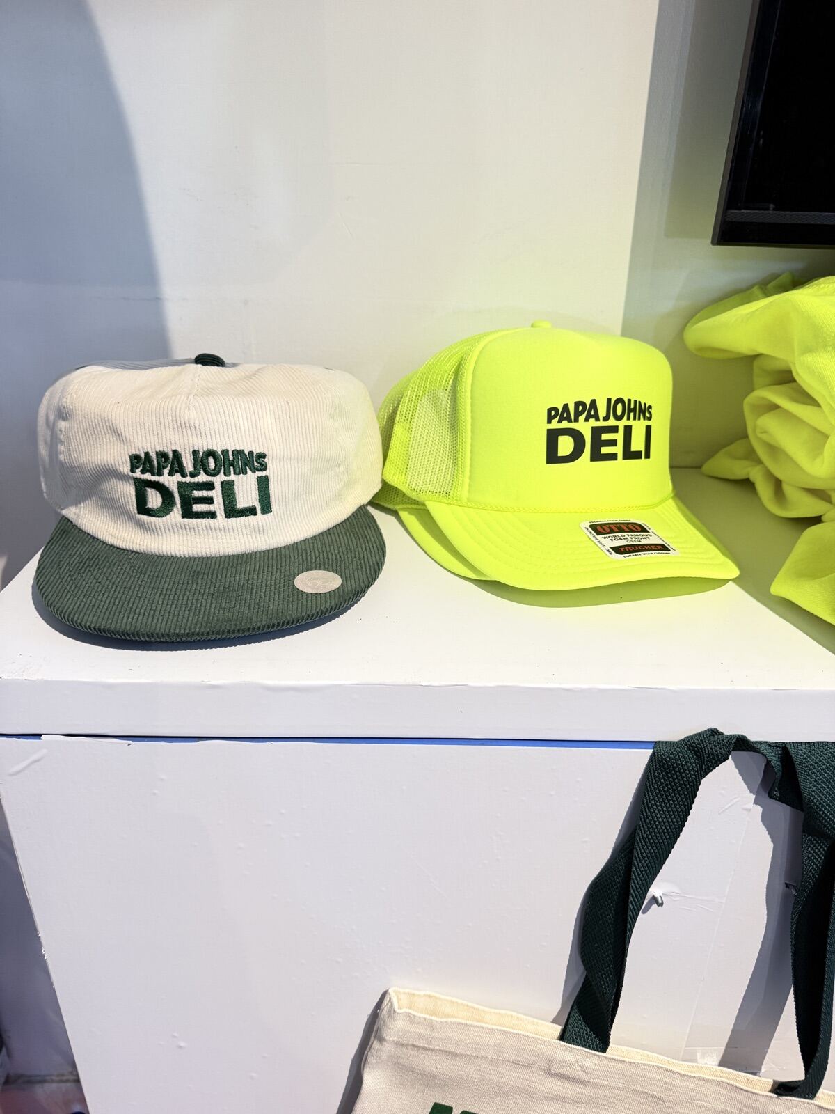 Embroidered hats and premium event merchandise on display