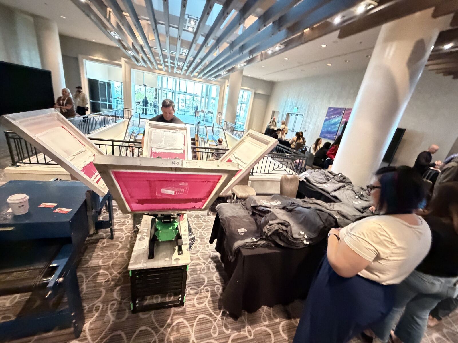 Live screen printing at a trade show activation
